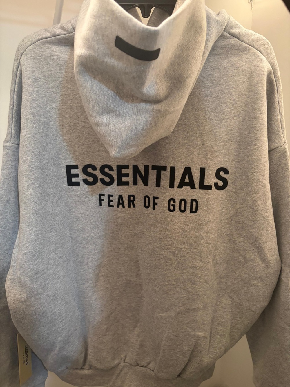 Fear of God Essentials Light Gray Hoodie with Black Logo